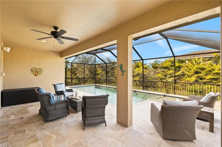 View of patio featuring an outdoor living space, a lanai, a fenced in pool, and ceiling fan
