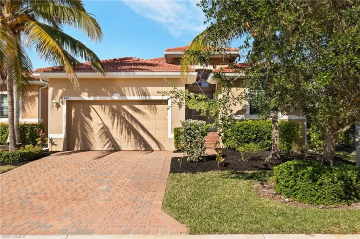 Mediterranean / spanish-style home with a garage