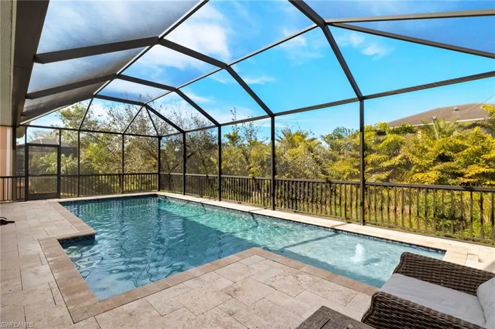 View of pool featuring a lanai and a patio area