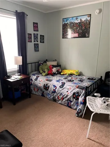 #2 Carpeted bedroom featuring ornamental molding