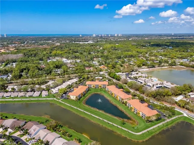 Aerial perspective of suburban area featuring a large body of water