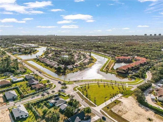 Aerial overview of property's location featuring a nearby lake and walking trails