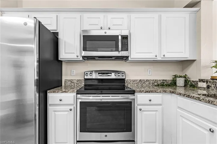 White cabinets, stainless appliances
