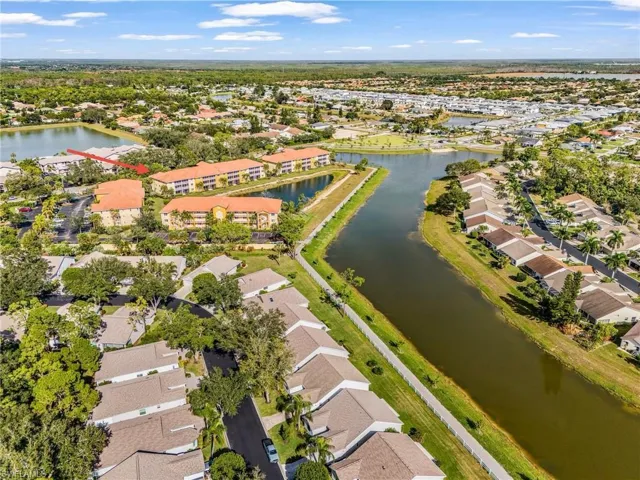 Aerial overview of property's location featuring nearby suburban area and a large body of water