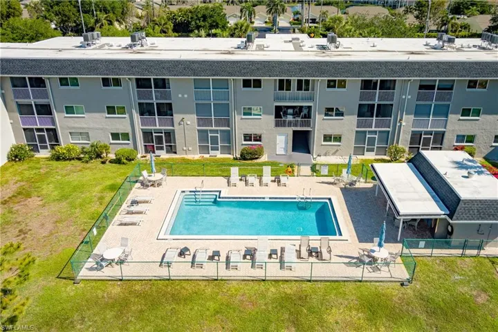 Pool featuring a patio area, fence, and a yard