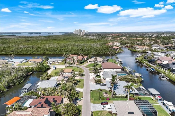 Birds eye view of property with a water view