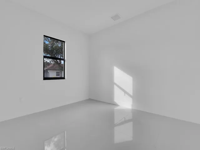 Bedroom # 2 with tile patterned flooring