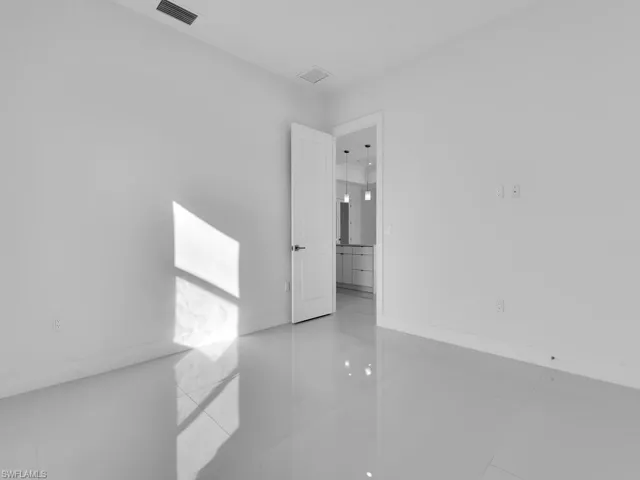 Bed room # 2 with light tile patterned floors