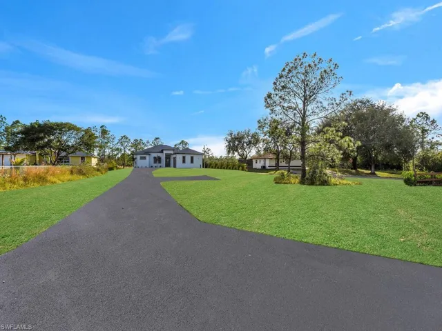 Ranch-style home with a front lawn