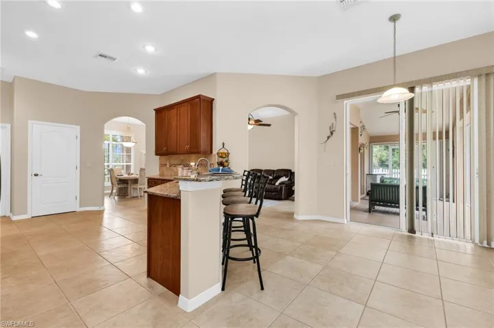 Spacious interior featuring neutral tone walls and large format tile flooring