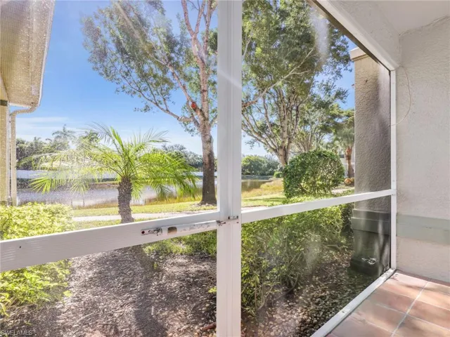 Unfurnished sunroom featuring a water view