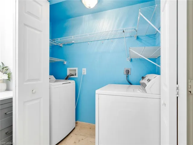 Laundry room featuring washer and clothes dryer
