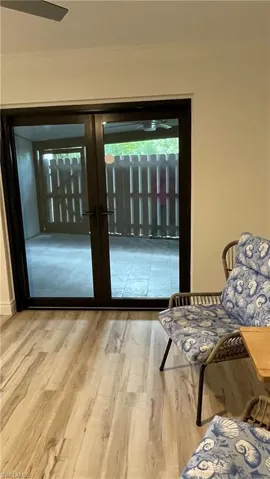 Entryway with french doors and hardwood / wood-style floors