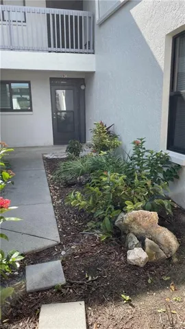 Property entrance with a balcony