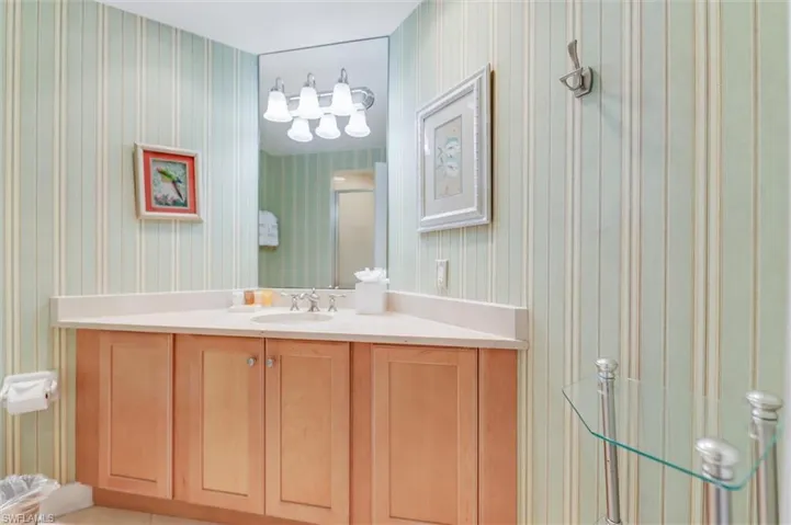Bathroom featuring vanity and a stall shower