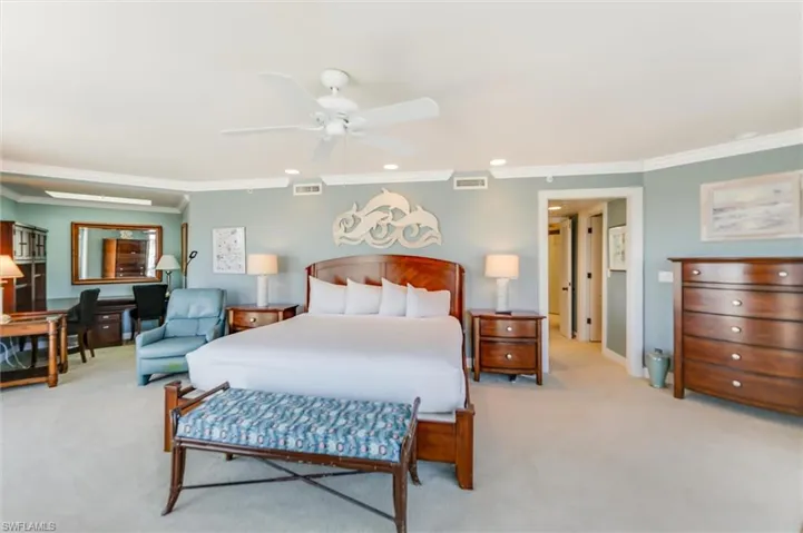 Bedroom featuring light colored carpet, ornamental molding, recessed lighting, and a ceiling fan