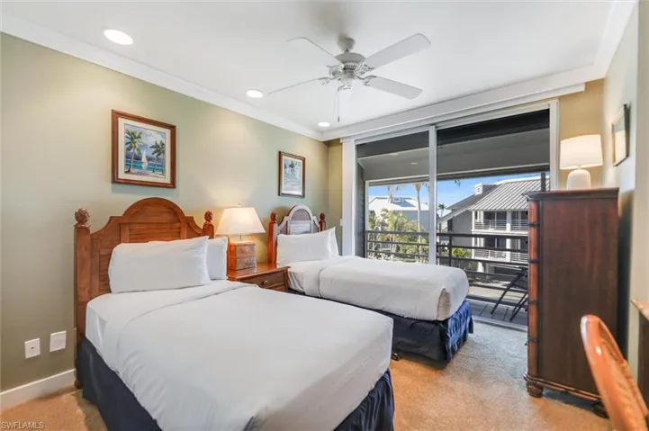 Bedroom with ornamental molding, recessed lighting, light colored carpet, a ceiling fan, and access to exterior