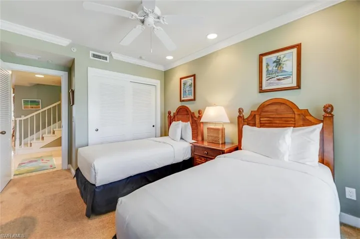 Bedroom featuring a closet, recessed lighting, carpet floors, ornamental molding, and a ceiling fan