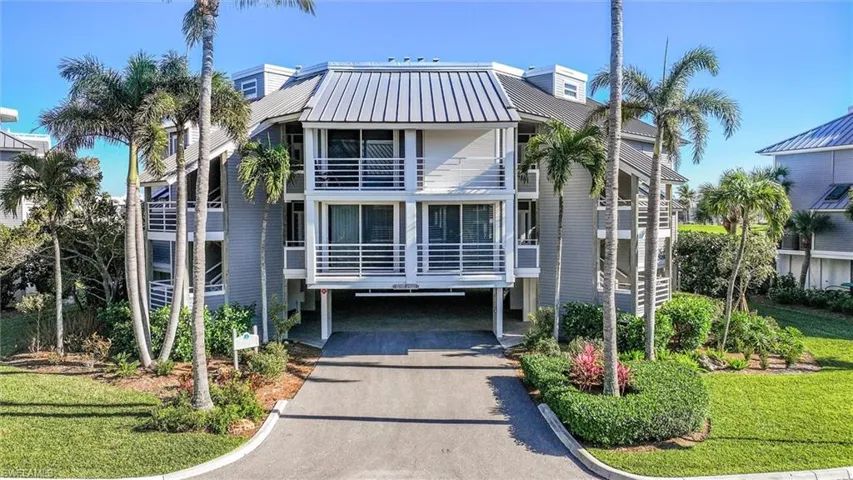 View of building exterior featuring driveway