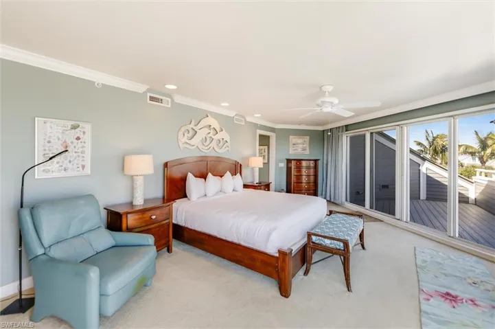 Carpeted bedroom featuring ornamental molding, a ceiling fan, access to outside, and recessed lighting