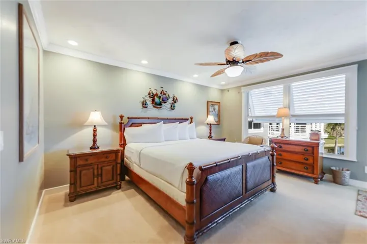 Bedroom with recessed lighting, crown molding, a ceiling fan, and carpet flooring