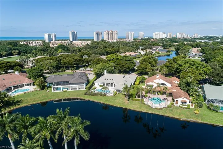 Aerial overview of property's location with city skyline and nearby suburban area