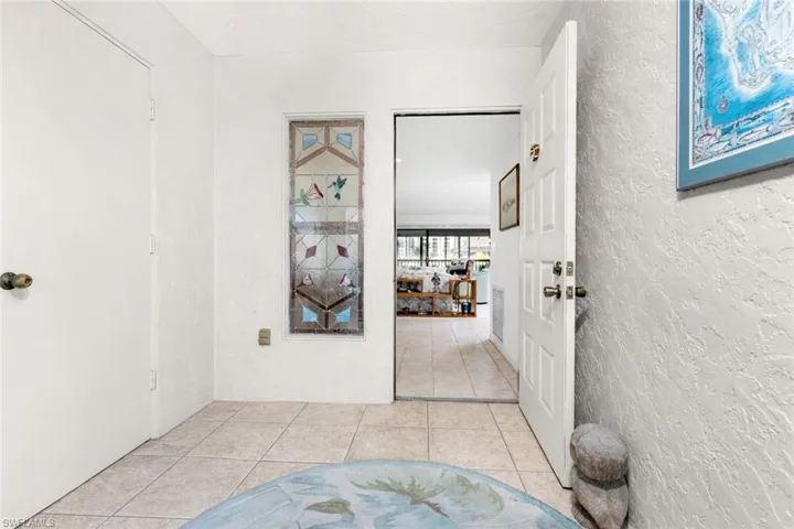 Private screened entry with storage closet