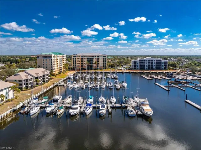 Aerial view of a nearby body of water and numerous boat docks