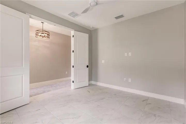 French doors to den/leisure room for privacy.