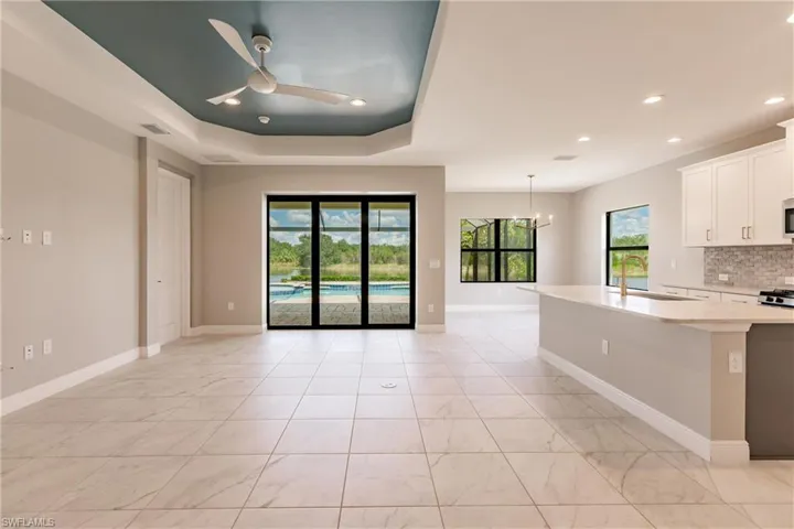 Sliding pocket doors to pool, spa and lake area.
