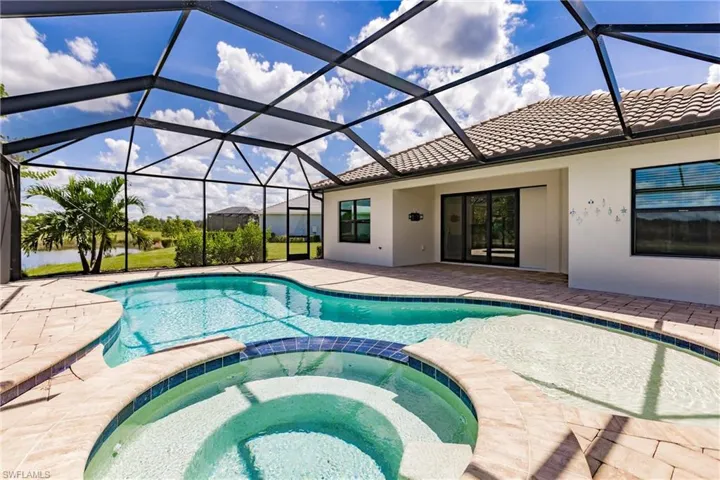 Gas heated pool and spa with waterfall feature.