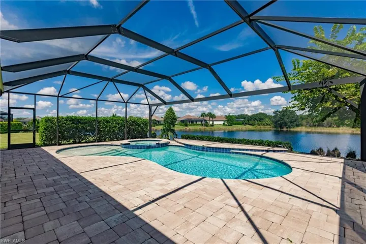 Large pool cage over heated pool and spa.
