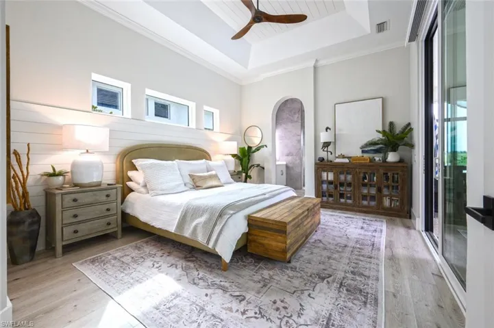 Spacious primary suite w/two closets and access to the lanai/courtyard