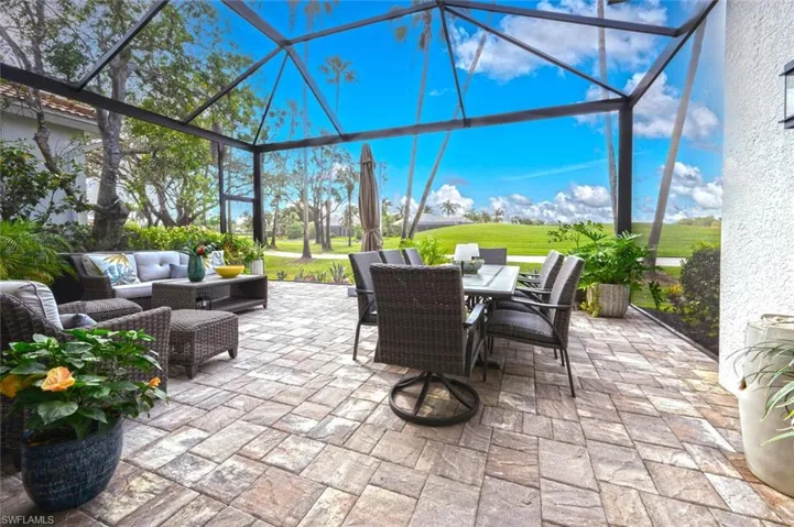Paradise awaits with expanded patio area with picture screen enclosure