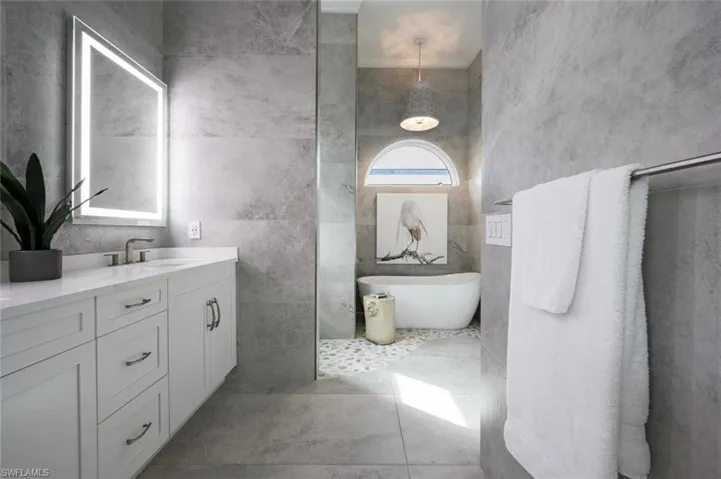 Entering the luxurious spa-like primary bathroom