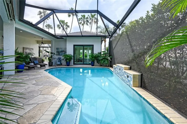 Inviting crystal blue pool waters - new tile, surface, and handrail