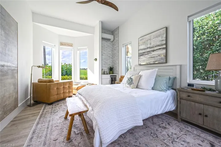 Spacious guest suite with seating area and beverage cooler