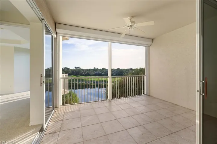 Unfurnished sunroom featuring a water view