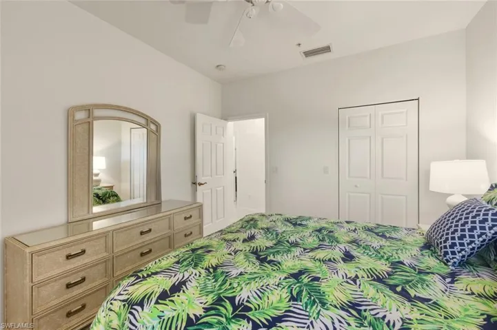 Bedroom featuring ceiling fan and a closet