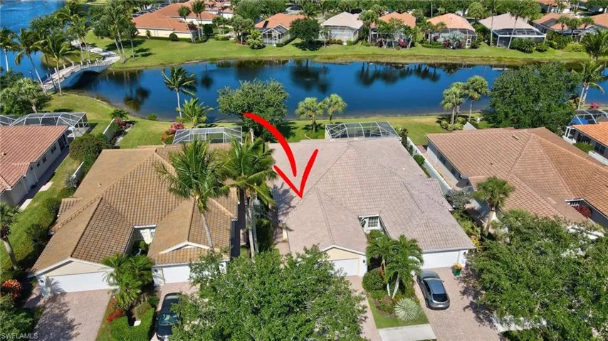Aerial view of residential area and lake.