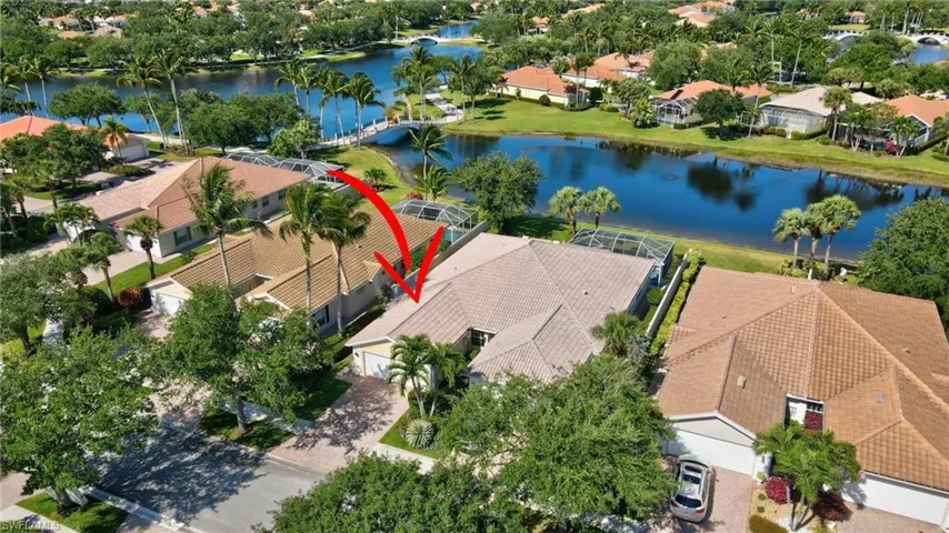Aerial view of residential area and lake.