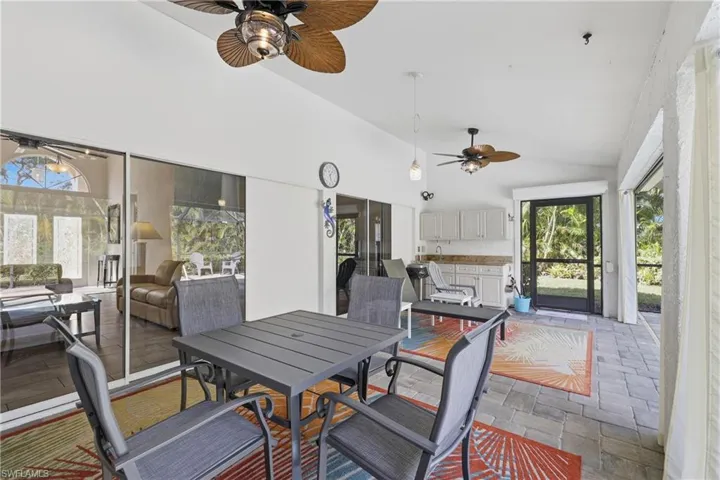 Screened Lanai, with plenty of covered sitting areas, bar sink and cabinets, and pool.