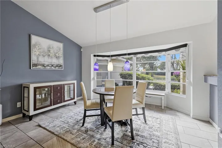 Dining room featuring bay window.