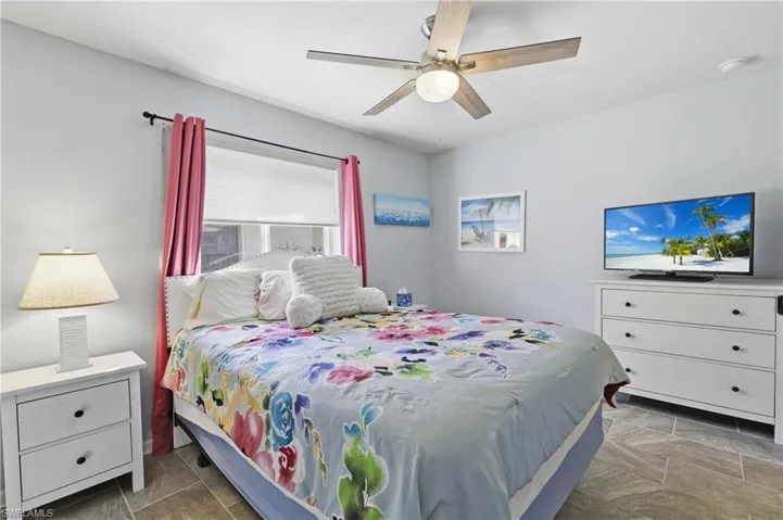 Bedroom with tile floors and soft paint
