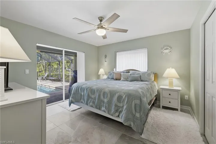 3rd Bedroom featuring a sliding glass door to the screened pool lanai and a ceiling fan