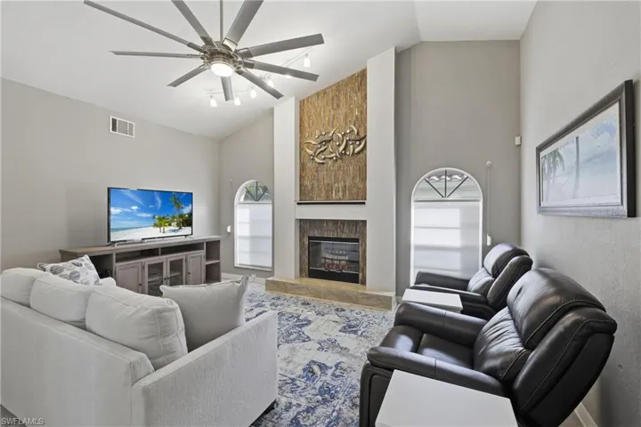 The Family Room is spacious with vaulted ceiling, and windows for natural light.