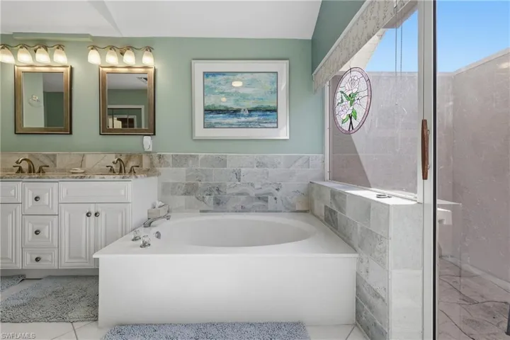 Bathroom with a bath and double vanity