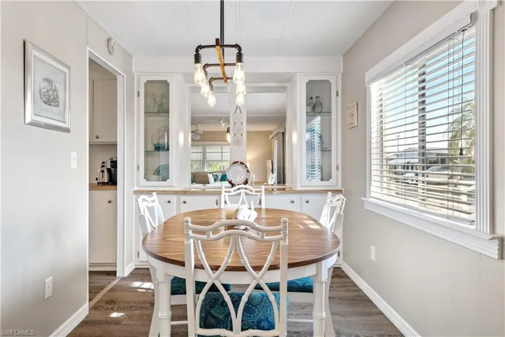 Dining area featuring a chandelier and dark