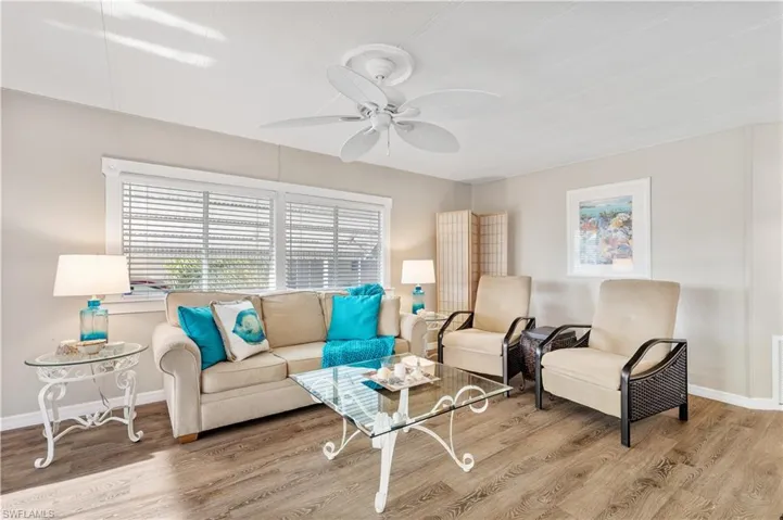 Living room with and a ceiling fan