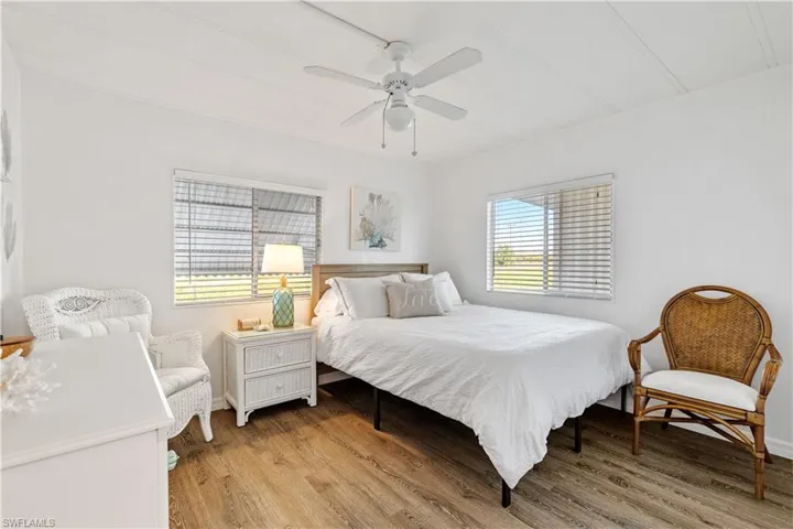 Bedroom featuring flooring and ceiling fan